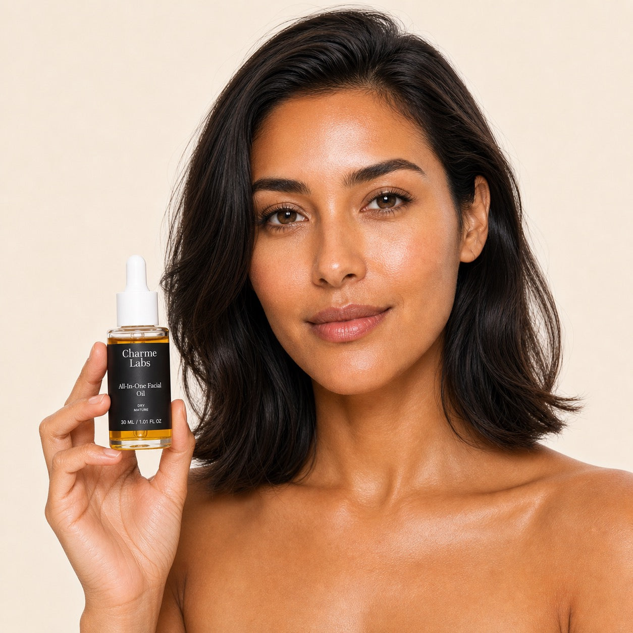 all-in-one-facial-oil held by model