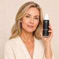 brightening-face-body-exfoliator-with-kojic-acid held by model